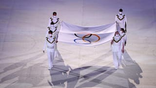 The flag bearers of the Olympic flag