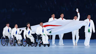 The Paralympic flag is carried during the Opening Ceremony of the Beijing 2022 Winter Paralympics