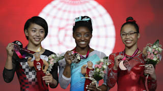 Mai Murakami (left), Simone Biles (center) and Morgan Hurd (right) share the women's all-around podium at the 2018 Worlds