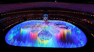 Flag bearers make their way into the Beijing National Stadium during the Beijing 2022 Winter Olympics Closing Ceremony