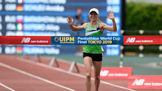 Laura Asadauskaite celebrates victory at the end of the Laser Run
