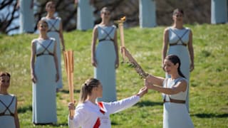 Anna Korakaki receives the flame at the Olympic Torch lighting ceremony in Olimpia, Greece