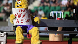 Legend the mascot holds a sign that reads "This Might Be A Sign" at the World Athletics Championships Oregon22. (Photo by Hannah Peters/Getty Images for World Athletics)