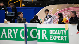 Hanyu shares a joke with coach Brian Orser in practice