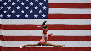 Simone Biles in front of USA flag