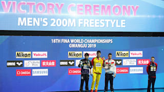 Katsuhiro Matsumoto of Japan, Sun Yang of China and Martin Malyutin of Russia pose during the medal ceremony for the Men's 200m Freestyle Final. Duncan Scott (R) of Great Britain opts not to pose for the traditional medallist photo. (Photo by Catherine Ivill/Getty Images)