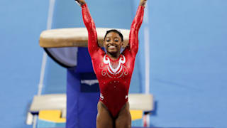 Simone Biles salutes after vaulting at the 2014 Worlds