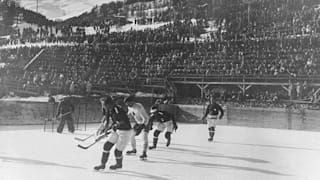 The Canadian and Swiss teams in action during a match in the Ice Hockey event