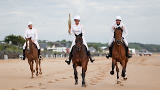 The Olympic Torch on a horse in Omaha Beach during the stage 20 of the Olympic Torch Relay