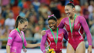 Larisa Iordache (left), Simone Biles (middle) and Kyla Ross (right) share a laugh during all-around awards at the 2014 Worlds