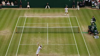 Rafael Nadal of Spain serves during the men's singles Final match against Roger Federer of Switzerland on day thirteen of the Wimbledon Lawn 2008