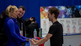 Jason Brown speaks to coach Tracy Wilson in practice as Brian Orser watches on