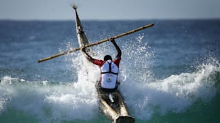 Peruvian surfer Carlos 'Huevito' Areola rides a reed board, or "caballito" (little horse), into a wave at Sydney's Bondi Beach, February 24, 2016. Areola is part of a group of Peruvian surfers touring Australia’s east coast to promote the use of the “caballito”. The "caballito" is thought to have been invented around 3,000 BC in northern Peru. REUTERS/Jason Reed 