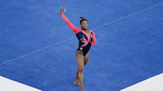 Simone Biles poses on floor during the apparatus final at the 2014 Worlds