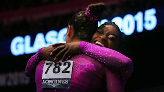Simone Biles and Maggie Nichols embrace after finishing first and third in the floor final at the 2015 Worlds