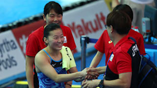 Sayaka Mikami of Japan celebrates her qualification with her team after the Women's 3m Springboard Semifinal on day seven of the Gwangju 2019 FINA World Championships at Nambu International Aquatics Centre on July 18, 2019 in Gwangju, South Korea. (Photo by Clive Rose/Getty Images)