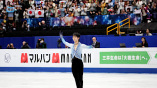 Yuzuru Hanyu waves to the crowd after his short program at the 2019 Worlds