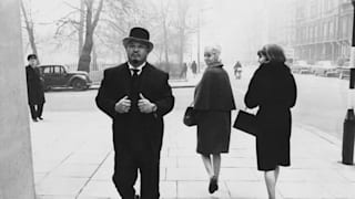 Sakata walking down a London street in 1965 (Keystone/Hulton Archive/Getty)