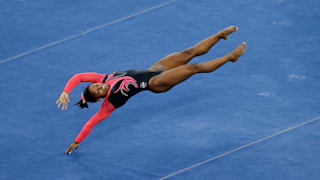 Simone Biles competes on floor during the apparatus final at the 2014 Worlds
