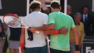 afael Nadal of Spain walks off the court at the net after his straight sets victory against Roger Federer of Switzerland in their final match during day eight of the Internazionali BNL d'Italia 2013