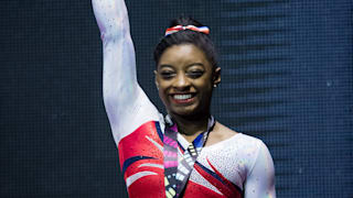 Simone Biles smiles on the vault podium at the 2015 Worlds (John Cheng/USA Gymnastics)