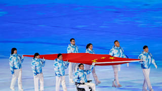 Chinese Paralympian representatives carry the Chinese flag during the Opening Ceremony of the Beijing 2022 Winter Paralympics