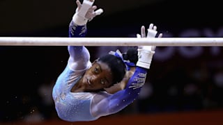 Simone Biles transitions from the low bar during the uneven bars final at the 2018 Worlds