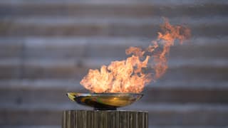 General view of the Olympic flame during the Flame Handover Ceremony for the Tokyo 2020 Summer Olympics (Photo by Aris Messinis - Pool/Getty Images Europe)