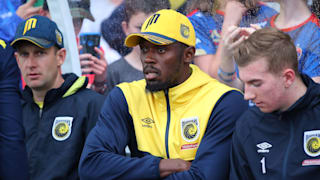 Usain Bolt watches Central Coast's A-League trial match with Newcastle from the bench