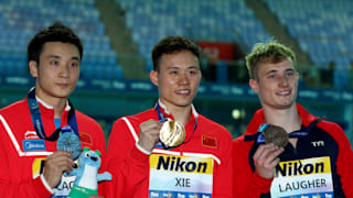 Yuan Cao of China, Siyi Xie of China and Jack Laugher of Great Britain pose during the medal ceremony for the Men's 3m Springboard Final on day seven of the Gwangju 2019 FINA World Championships at Nambu International Aquatics Centre on July 18, 2019 in Gwangju, South Korea. (Photo by Clive Rose/Getty Images)