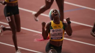 Shelly-Ann Fraser-Pryce celebrates after winning her fourth 100m world title at the 2019 IAAF World Championships in Doha