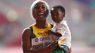 Shelly-Ann Fraser-Pryce with son Zyon after her 100m triumph at the 2019 IAAF World Championships in Doha