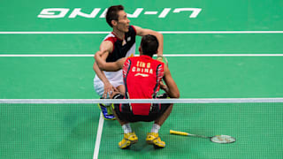 Lin Dan checks on an injured Lee Chong Wei in the decider of the 2013 World Championship final in Guangzhou