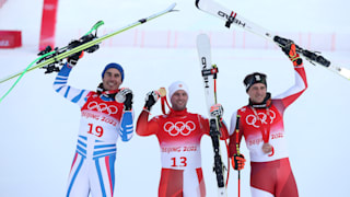 Men's downhill podium (L-R): runner-up Johan Clarey, gold medallist Beat Feuz, third-placed Matthias Mayer