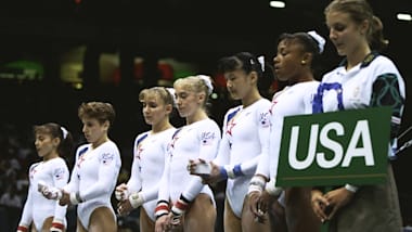 Strug helps 'Magnificent Seven' to gymnastics team gold