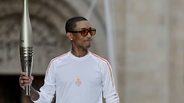 Happy Pharrell Williams brings style to Olympic Torch Relay