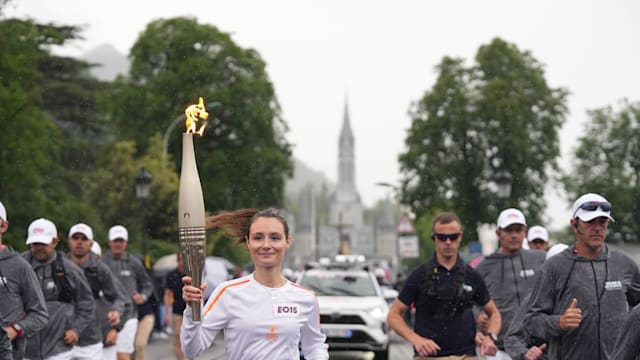 The Olympic torch flirts with the clouds in Hautes-Pyrénées