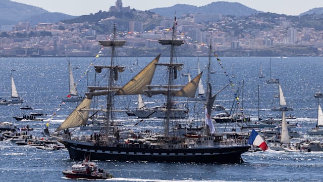 Thousands gather in Marseille to watch the Olympic flame arrive in France