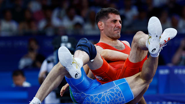 Refugee Valizadeh does his family of wrestlers proud at Paris 2024