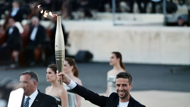 Olympic flame passed to Paris 2024 delegation during handover ceremony in Athens