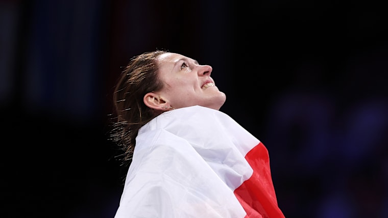 Manon Apithy-Brunet of Team France celebrates after winning the fencing women's sabre individual gold medal at Paris 2024