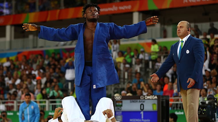 Popole Misenga of the Refugee Olympic Team celebrates after defeating Avtar Singh of India during a Men's -90kg bout on Day 5 of the Rio 2016 Olympic Games at Carioca Arena 2 on August 10, 2016 in Rio de Janeiro, Brazil. (Photo by Elsa/Getty Images)