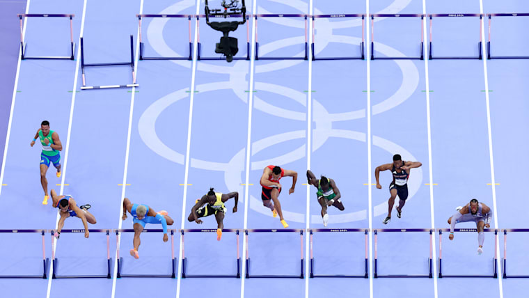An aerial view as the spider cam films athletes competing in heat 2 of the men's 110m hurdles semifinals at the Olympic Games Paris 2024.