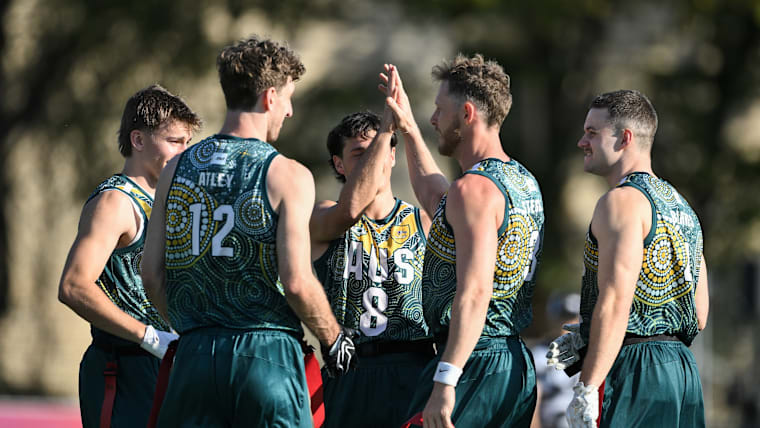Jared Stegman (3) and his national teammates celebrate on the field at the 2026 IFAF Flag Football World Championships.
