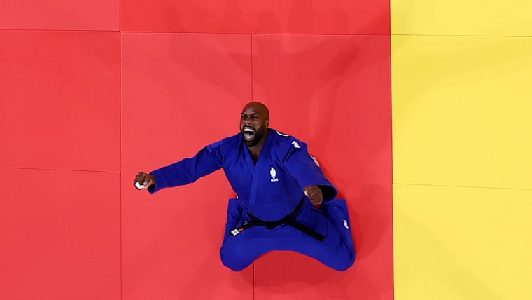 Teddy Riner celebrates winning the gold medal after his victory against Minjong Kim  in the Judo Men +100kg Final at Paris 2024