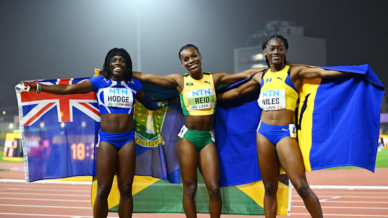 Alana Reid of Jamaica poses with silver medallist Adaejah Hodge of the British Virgin Islands and bronze medallist Kishawna Niles of Barbados after winning the women's 100m at the World U20 Championships in Lima.