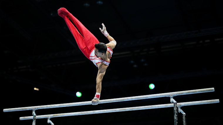 Ferhat Arican of Turkey performs on the Parallel Bars
