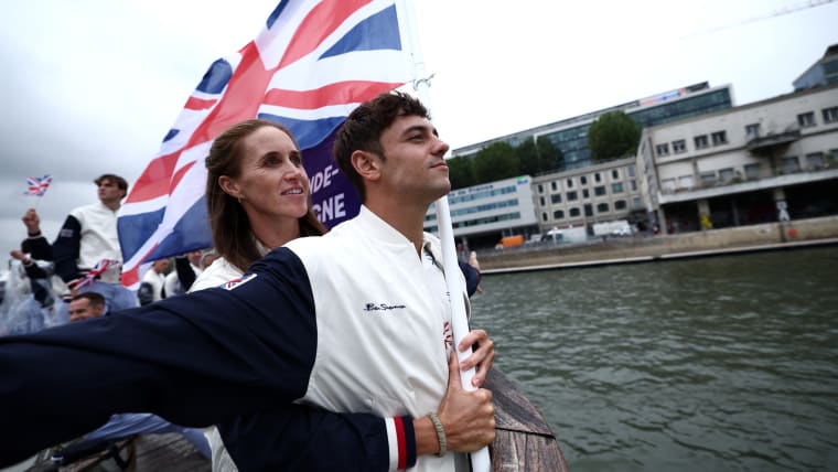 Thomas Daley, Helen Glover, Flagbearers of Team Great Britain, gesture on a boat