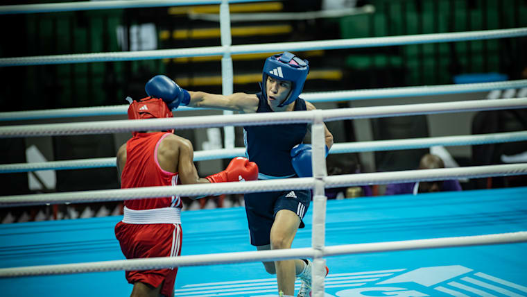Roumaysa Boulam of Algeria (in blue) competes in competesin the Boxing Road to Paris qualification tournament in Dakar against Gezahegn Gayiza of Ethiopia.