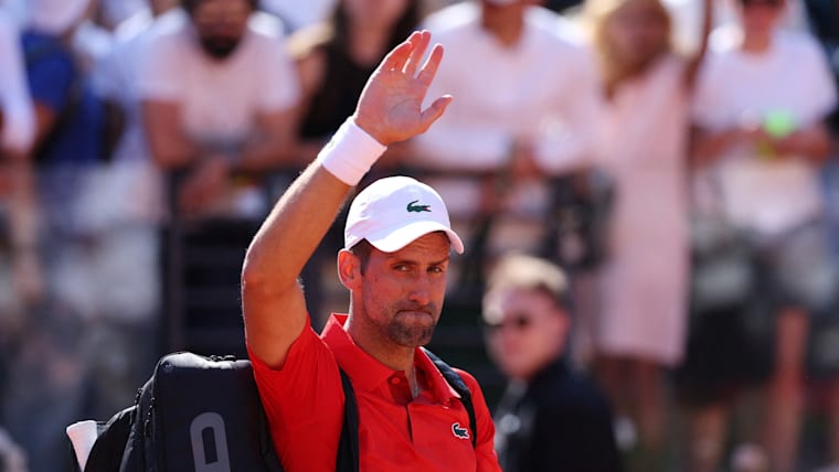 Novak Djokovic waves to the crowd after his shock Italian Open defeat to Alejandro Tabilo